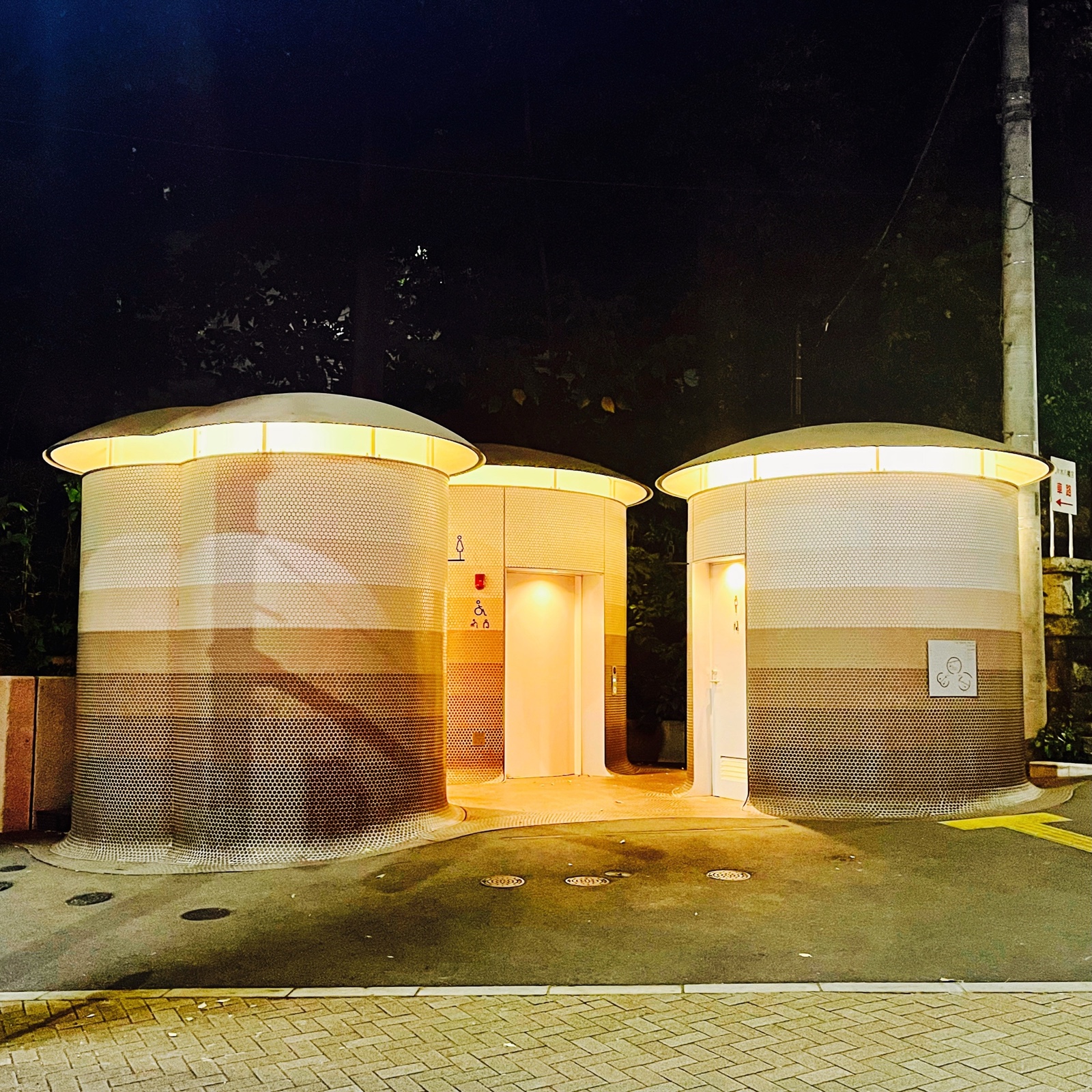MoonTed Diary: The mushroom-shaped public toilets of The Tokyo Toilet near Yoyogi Hachimangu, lit up at night